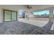 Covered patio with ceiling fan, recessed lights, and a seamless transition to a large paver patio at 6075 Dapple Gray Rd, Las Vegas, NV 89149