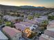 Panoramic aerial view of the community showcasing the well-maintained homes and mountain views at 6546 American Flower St, Las Vegas, NV 89148