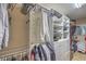 Well-organized walk-in closet featuring custom shelving and hanging rods for efficient storage solutions at 6546 American Flower St, Las Vegas, NV 89148