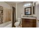 Full bathroom featuring a shower-tub combo and granite counter tops at 672 Solitude Point Ave, Henderson, NV 89012