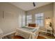 Comfortable bedroom with a queen bed, closet, and bright natural light at 672 Solitude Point Ave, Henderson, NV 89012