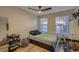 Cozy bedroom with natural lighting and carpeted floor at 672 Solitude Point Ave, Henderson, NV 89012