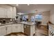 Bright kitchen with granite countertops, stainless steel appliances, and a breakfast bar at 672 Solitude Point Ave, Henderson, NV 89012