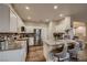 Well-equipped kitchen with stainless steel appliances, granite countertops, and bar seating at 672 Solitude Point Ave, Henderson, NV 89012
