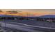 Street view showcasing the surrounding neighborhood and landscape with beautiful sky and mountain views at 672 Solitude Point Ave, Henderson, NV 89012