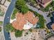 The aerial view showcases a luxury tile roof home with beautiful landscaping, and a pool at 7 Rue Promenade Way, Henderson, NV 89011