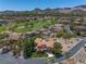 Stunning aerial view showcases a luxurious estate, golf course, and mountain views at 7 Rue Promenade Way, Henderson, NV 89011