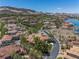 Expansive aerial view of a luxury real estate showcasing tile roofs in a desert setting at 7 Rue Promenade Way, Henderson, NV 89011