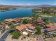 Magnificent aerial view of lakeside houses in a luxurious neighborhood, with lush trees at 7 Rue Promenade Way, Henderson, NV 89011