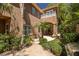 Lush backyard featuring a covered patio, mature landscaping and an outdoor grill at 7 Rue Promenade Way, Henderson, NV 89011
