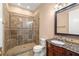 Bathroom features granite vanity and stone shower with glass door at 7 Rue Promenade Way, Henderson, NV 89011