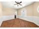 Neutral bedroom with hardwood floors, fan, window and custom molding at 7 Rue Promenade Way, Henderson, NV 89011
