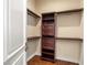 Small closet with dark wood built-in shelves and drawers at 7 Rue Promenade Way, Henderson, NV 89011