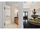 Stately entryway with water fountain and view to powder room; the perfect blend of luxury and functionality at 7 Rue Promenade Way, Henderson, NV 89011