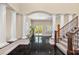Grand entryway featuring black tile floor, staircase and stately pillars, offering a luxurious welcome at 7 Rue Promenade Way, Henderson, NV 89011