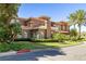 Two-story house with portico, stucco exterior, and mature landscaping at 7 Rue Promenade Way, Henderson, NV 89011