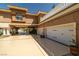 Mediterranean home featuring a three-car garage, portico, and manicured landscaping at 7 Rue Promenade Way, Henderson, NV 89011