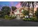Stunning two-story home with lush landscaping and an elegant porte-cochere at 7 Rue Promenade Way, Henderson, NV 89011