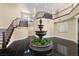 Spacious foyer with a water fountain, staircase, and marble floors at 7 Rue Promenade Way, Henderson, NV 89011