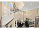 Upper-level view of the foyer showing chandelier, formal seating, and water fountain at 7 Rue Promenade Way, Henderson, NV 89011