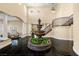 Elegant foyer with a water fountain, staircase, and dark marble floors at 7 Rue Promenade Way, Henderson, NV 89011