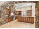 Gourmet kitchen features stone accents, custom cabinetry, granite countertops, and high-end stainless steel appliances at 7 Rue Promenade Way, Henderson, NV 89011