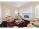 Bright formal living room features a fireplace, seating, and natural light at 7 Rue Promenade Way, Henderson, NV 89011