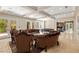 Elegant living room with coffered ceilings, stone fireplace, and glass doors to the outdoor space at 7 Rue Promenade Way, Henderson, NV 89011