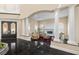 Luxurious living room with marble fireplace, columns, and black marble flooring at 7 Rue Promenade Way, Henderson, NV 89011