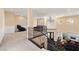 Elegant loft features wrought iron railings, high ceilings, chandelier, and views of the living room below at 7 Rue Promenade Way, Henderson, NV 89011