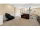 Cozy loft area with seating, views of the front entry, and a comfortable reading chair at 7 Rue Promenade Way, Henderson, NV 89011