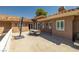 An outdoor patio area with an umbrella table in a well maintained home at 7 Rue Promenade Way, Henderson, NV 89011