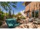 Beautiful pool and patio area, surrounded by lush landscaping and mature trees at 7 Rue Promenade Way, Henderson, NV 89011