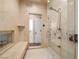 Modern shower with glass door, marble bench, and chrome fixtures at 7 Rue Promenade Way, Henderson, NV 89011