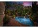This luxury outdoor pool and spa feature lush landscaping and water feature for your enjoyment at 7 Rue Promenade Way, Henderson, NV 89011