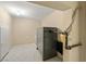 Utility room with an older furnace, carpet flooring, white walls, and door at 7 Rue Promenade Way, Henderson, NV 89011