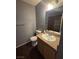Bathroom featuring granite countertops, a full mirror, and tiled shower at 7100 Pirates Cove Rd # 1099, Las Vegas, NV 89145