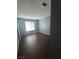 Cozy bedroom featuring tile flooring, a window, and neutral paint at 7100 Pirates Cove Rd # 1099, Las Vegas, NV 89145