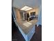 Kitchen featuring stainless steel appliances, light wood cabinets, and a granite countertop breakfast bar at 7100 Pirates Cove Rd # 1099, Las Vegas, NV 89145