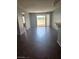 The open-concept living room features tile flooring and a sliding door to a balcony at 7100 Pirates Cove Rd # 1099, Las Vegas, NV 89145