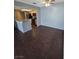 Living room showing kitchen with stainless appliances and granite countertop bar area. Tiled floors throughout at 7100 Pirates Cove Rd # 1099, Las Vegas, NV 89145