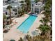 Resort style community pool with palm trees and lounge chairs create a relaxing outdoor space at 7100 Pirates Cove Rd # 1099, Las Vegas, NV 89145