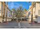 Inviting condo complex with lush landscaping, palm trees, and well-maintained buildings in a desirable location at 7127 S Durango Dr # 310, Las Vegas, NV 89113
