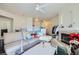 Open-concept living room with a fireplace, neutral decor, and seamless flow to the kitchen at 7127 S Durango Dr # 310, Las Vegas, NV 89113