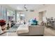 Bright living room featuring sliding doors, neutral tones, and comfortable furniture at 7127 S Durango Dr # 310, Las Vegas, NV 89113