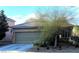 Charming single-story home features a well-manicured front yard and an attached two-car garage at 728 Brown Breeches Ave, North Las Vegas, NV 89081
