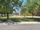 Neighborhood park with walking paths, green space, and mature trees at 728 Brown Breeches Ave, North Las Vegas, NV 89081