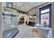 Modern bathroom features a soaking tub, glass-enclosed shower, and access to the walk-in closet at 7311 Chaparral Cove Ln, Las Vegas, NV 89131