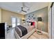 Cozy bedroom with a soft bed, stylish decor, and access to an outdoor patio space at 7311 Chaparral Cove Ln, Las Vegas, NV 89131
