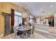 Dining area showcasing a decorative light fixture and access to the kitchen at 7311 Chaparral Cove Ln, Las Vegas, NV 89131